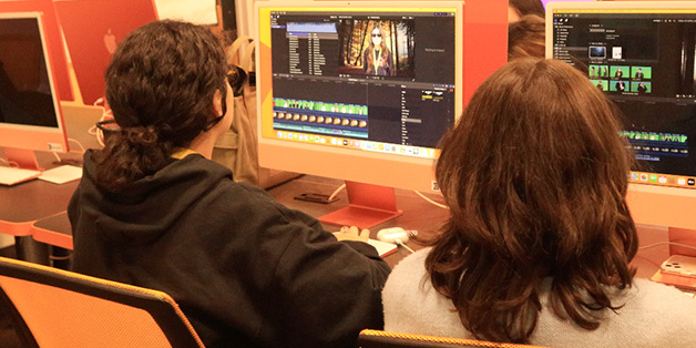 Students using Final Cut Pro to edit videos on iMac