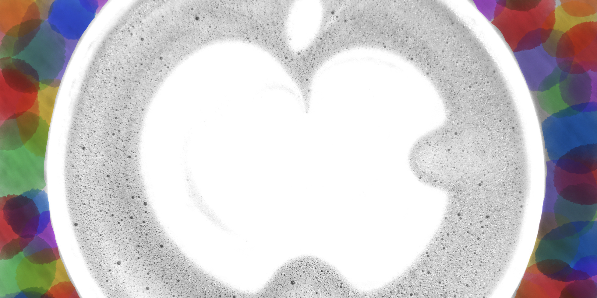 An overhead view of a latte with the Apple Logo as foam art, enhanced with color splotches.